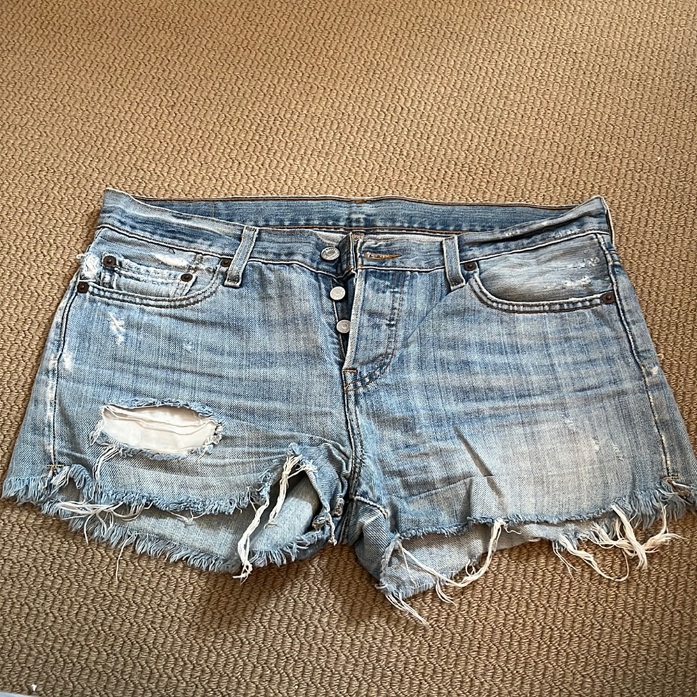 Levi’s, cutoff denim shorts in light blue, size 27